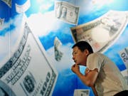 China hat die gesetzliche Grundlage für Online-Geld geschaffen und macht bei Kryptowährungen einen Satz nach vorne. (Bild: KEYSTONE/AP)
