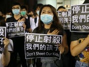 Soll als Vermummung verboten werden: Demonstration mit Atemschutzmasken in Hongkong. (Bild: KEYSTONE/EPA/JEROME FAVRE)