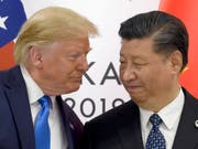Der Handelsstreit zwischen den USA unter der Führung von US-Präsident Donald Trump kostet das Reich der Mitte unter Präsident Xi Jinping viele Milliarden. (Bild: KEYSTONE/AP/SUSAN WALSH)