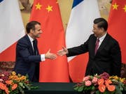 Der französische Präsident Emmanuel Macron (l) und der chinesische Staatschef Xi Jinping warnen in einem gemeinsamen Papier, dass «der Verlust biologischer Vielfalt und der Klimawandel weltweit den Frieden und die Stabilität bedrohen». (Bild: KEYSTONE/EPA AFP POOL/NICOLAS ASFOURI / POOL)