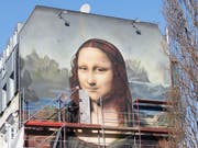 Mona Lisa lächelt neu in Übergrösse in Berlin. (Bild: KEYSTONE/dpa/ANNETTE RIEDL)