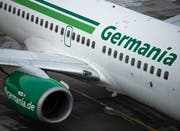 Ein Flugzeug der Fluggesellschaft Germania. Die Berliner Fluggesellschaft ist pleite. Bild: Monika Skolimowska/KEY