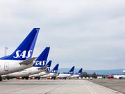 Parkierte Maschinen der skandinavischen Airline SAS am Flughafen in Oslo. (Bild: KEYSTONE/AP NTB Scanpix/OLE BERG-RUSTEN)