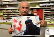 Giorgio Ghiringhelli, Initiant des Tessiner Burkaverbots, bei sich zu Hause in Losone.Bild: Karl Mathis/Keystone (3. September 2013)