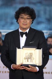 Der südkoreanische Filmemacher Bong Joon-ho nach der Preisvergabe in Cannes. Foto: Petros Giannakouris