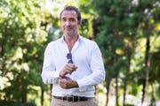 Sein Grinsen ist sein Markenzeichen: Schauspieler Jean Dujardin. (Bild: Alexandra Wey/Keystone)