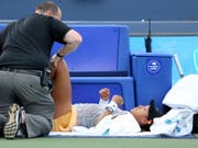 Naomi Osaka musste sich am Knie behandeln lassen, ehe sie zwei Punkte später aufgab (Bild: KEYSTONE/AP The Cincinnati Enquirer/KAREEM ELGAZZAR)
