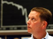 Die internationalen Finanzmärkte reagieren mit Skepsis auf die neueste Eskalation im Handelsstreit zwischen den USA und China. (Bild: KEYSTONE/AP/BERND KAMMERER)
