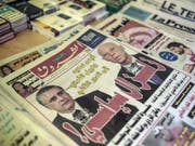 Kaïs Saïed (r) und Nabil Karoui, die beiden voraussichtlichen Wahlsieger, auf der Titelseite einer Zeitung am Montag. (Bild: Keystone/AP/MOSA'AB ELSHAMY)