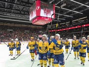 Die Davoser Spieler freuen sich nach dem 7:1-Kantersieg in Lausanne (Bild: KEYSTONE/LAURENT GILLIERON)