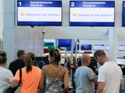 Nach der Insolvenz von Thomas Cook müssen sich Kunden des Reiseveranstalters auch noch vor Abzocke durch betrügerische E-Mails wappnen. (Bild: KEYSTONE/AP/VICTOR RUIZ)