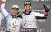 Beat Feuz und Vincent Kriechmayer duellieren sich im Abfahrtsweltcup. (Bild: EPA)