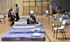Evakuierte Bewohner in einer Unterkunft. (Bild: EPA/ATIENZA)
