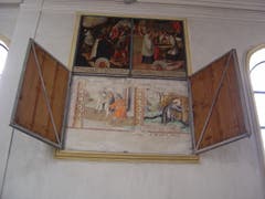 Der alte St. Jost-Bilderzyklus in der Kirche St. Jost in Blatten bei Malters erscheint hinter den hölzernen Tafeln des neueren Bilderzyklus. (Bild: PD)