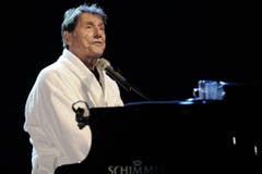 Das Markenzeichen des Stars: Auftritt im Bademantel. (Bild: Keystone)
