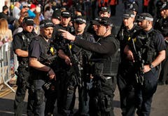 Bewaffnete Polizisten sollen für Sicherheit sorgen. (John Sibley/pool photo via AP)