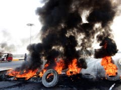Die Wut der Bürger in den Strassen von Bagdad. (Bild: KEYSTONE/EPA/MURTAJA LATEEF)