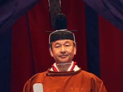 Japans neuer Kaiser Naruhito hat am Dienstag knapp ein halbes Jahr nach seiner Amtsübernahme offiziell seine Inthronisierung verkündet. (Bild: KEYSTONE/AP Pool Rueters/ISSEI KATO)