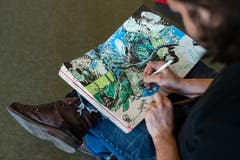 Das Comic-Wimmelbild in verträumten Farben nimmt Form an.
