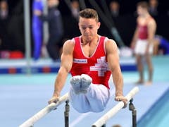 Für Christian Baumann sind die Titelkämpfe in Stettin noch nicht zu Ende, am Sonntag kämpft er am Barren um die Medaillen (Bild: KEYSTONE/EPA PAP/MARCIN BIELECKI)