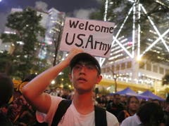 Demonstrant in Hongonk. (Bild: KEYSTONE/EPA/ROMAN PILIPEY)