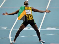 Usain Bolt wirft sich in Pose, hier nach seinem 200-m-Gold 2013 in Moskau. (Bild: KEYSTONE/AP/MARTIN MEISSNER)